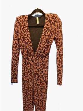 Leopard Textured Long Sleeve Jumpsuit in Brown. Shoulder pads. Very stretchy.